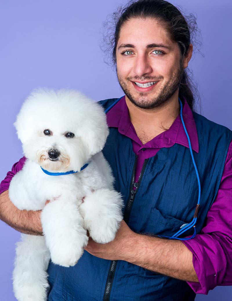 Owner Blake Hernandez and his seven month-old Bichon Frise, 