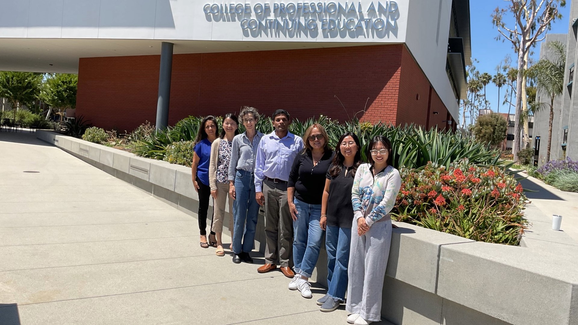 CSU Biomanufacturing Consortium faculty and staff from CSU Long Beach, Fullerton, and Los Angeles stand outside the CPACE building.