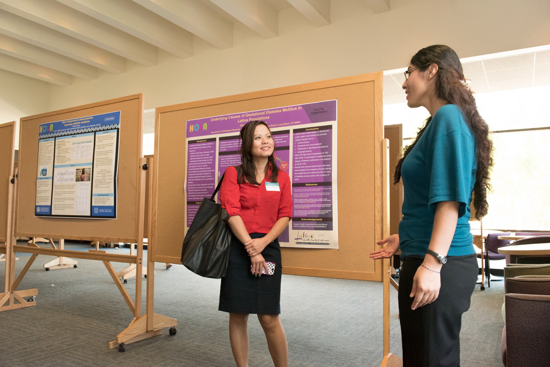 Image of students talking at a research event