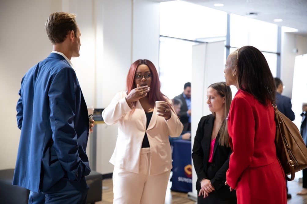 A group of people standing in a room