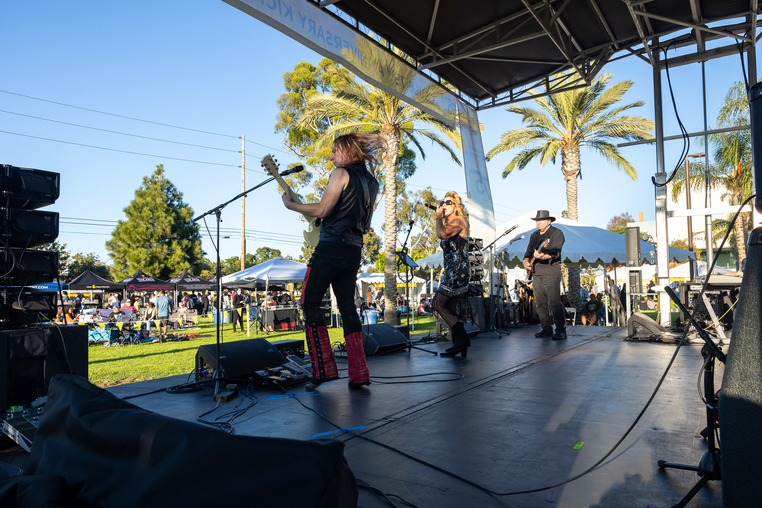 Members of the rock band Higher Ed on stage