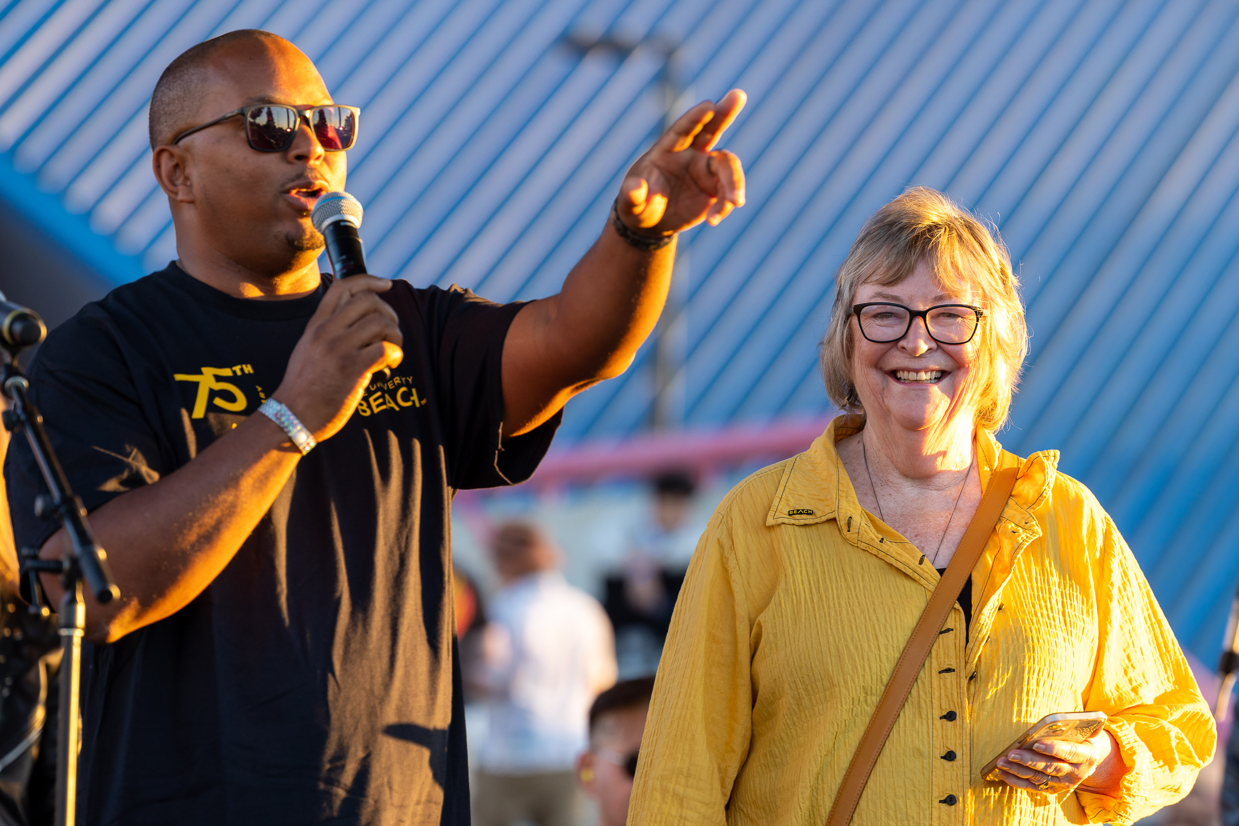 Long Beach Mayor Rex Richardson, with microphone, and President Jane Close Conoley