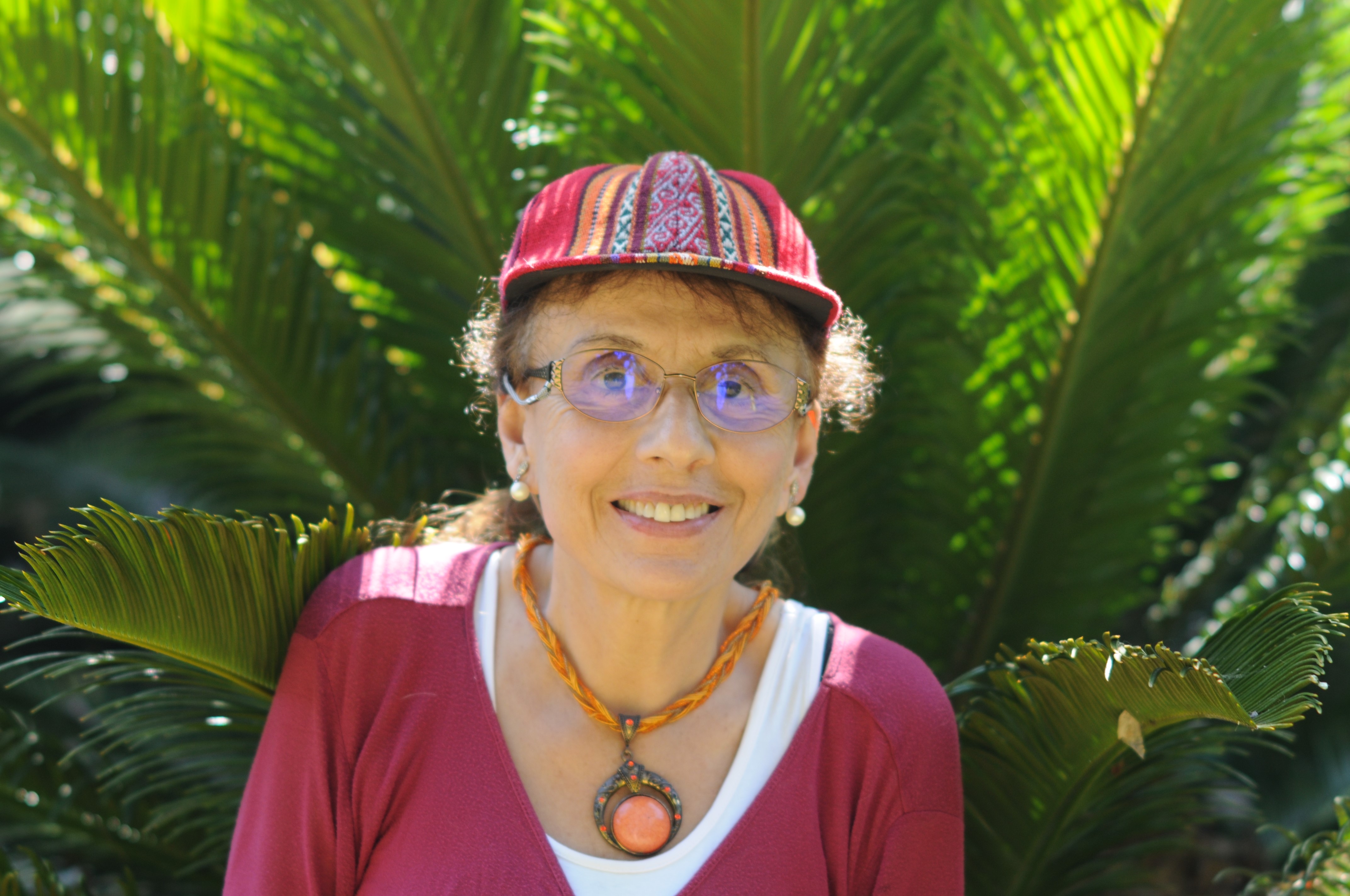 woman in front of fern