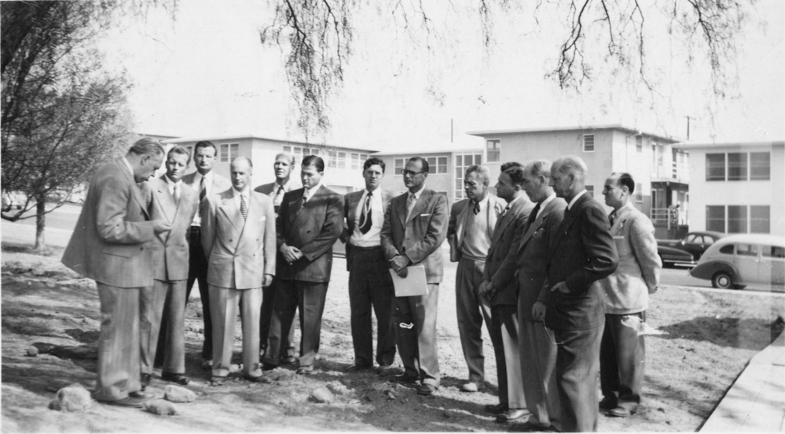 CSULB faculty members meeting under a pepper tree, 1949