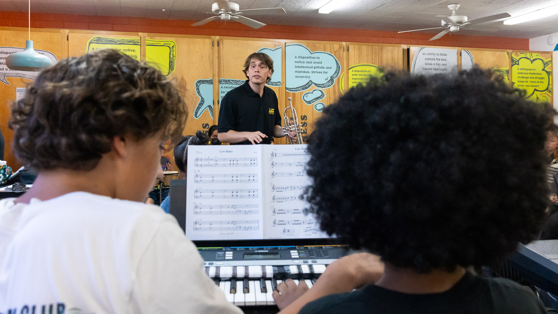 CSULB student Ben Rifkin teaching music to children