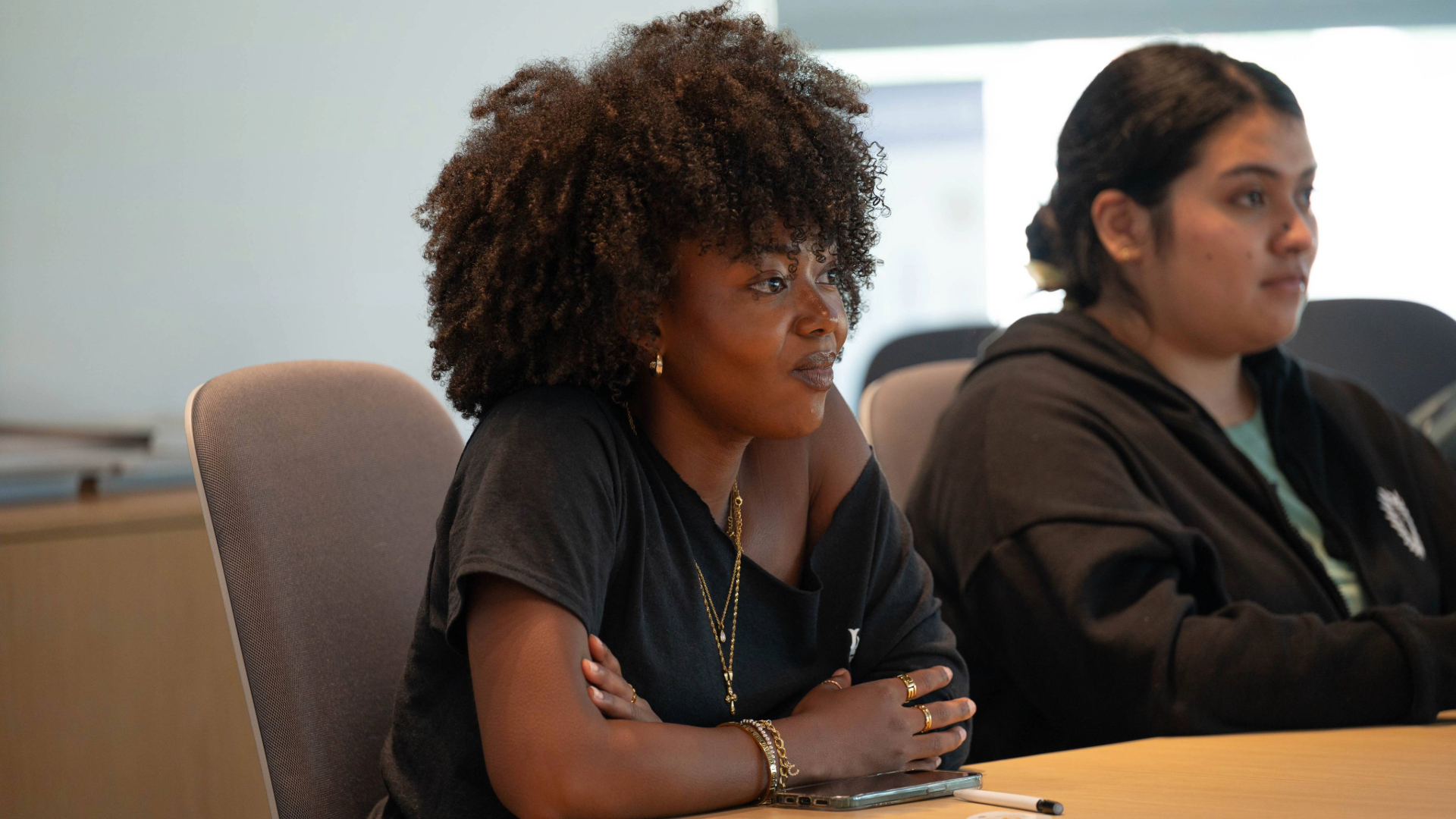 A student sits in a classroom. 