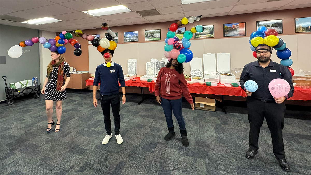 people wearing funny balloon hats