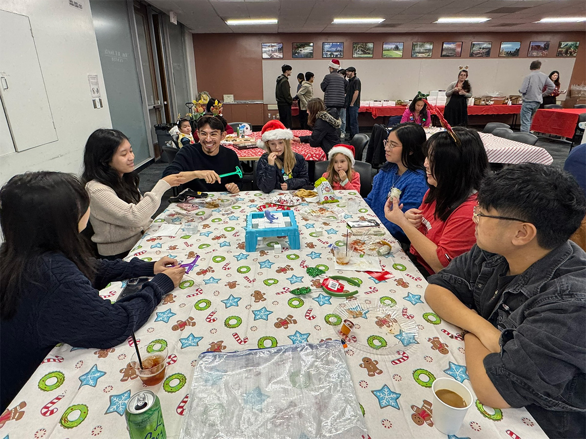 group gathered at a table and playing games