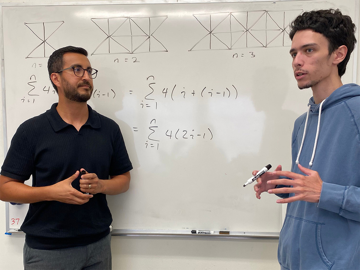 Graduate student Gabriel Fanucchi discussing a math topic