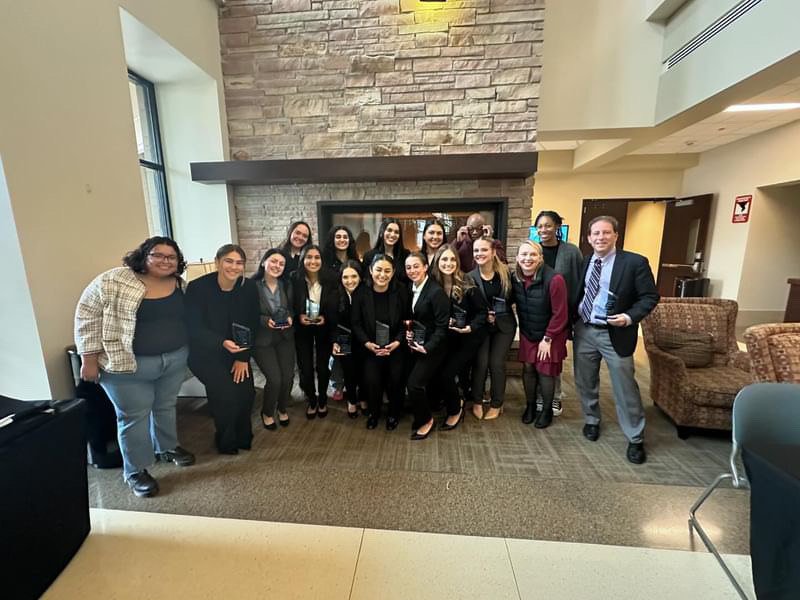 Front row, from left: Jacquelene Zambrano (assistant coach), Jocelyn Colpitts, Ashley Harding, Ivonne Sotelo, Mikayla Browne, Jocelyn Soto-Rivera, Morgan Barragan, Kylie Barnhart, Emma Nelson, Alex Lohman (assistant coach), and Lewis Ringel (head coach). Back row from left: Jordan Gebrian, Farnoz Norouzi, Stevie De La Fuente, Alexa Alvarez, Patrick Dyson (assistant coach), and Kamra Jackson (assistant coach).