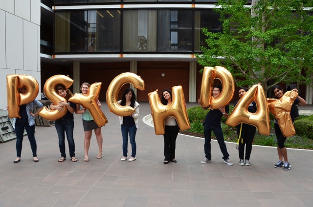 students holding psych day balloons 