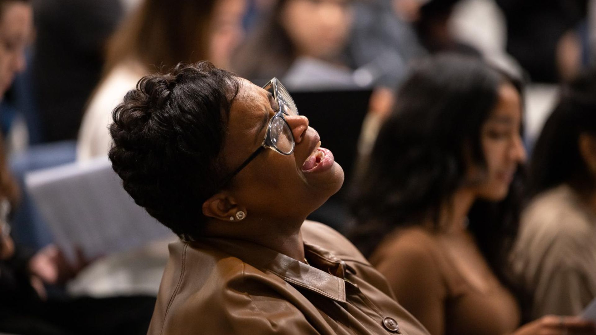 Daria-Yvonne Jackson Graham sings with emotion during a choral rehearsal.