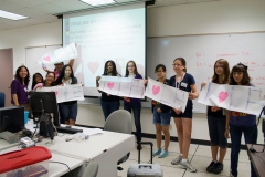 interns holding I love LB signs