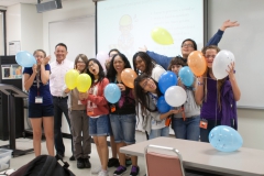 interns holding balloons