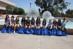 interns in front of fountain