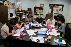 interns doing activity at table