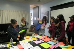 interns with sheets of paper