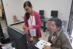 interns talking around computer