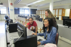 interns talking around computer