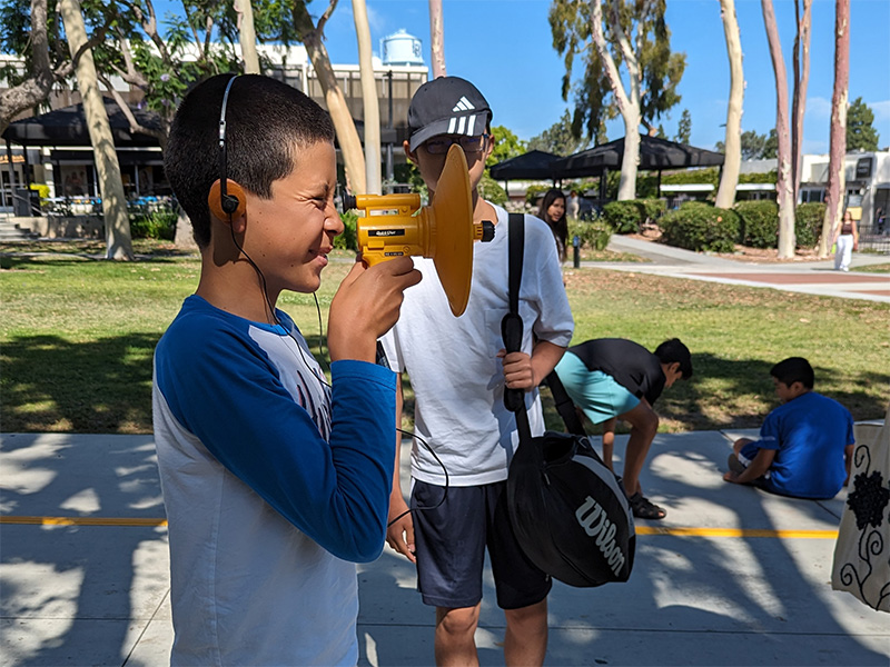 kid with a sonic device