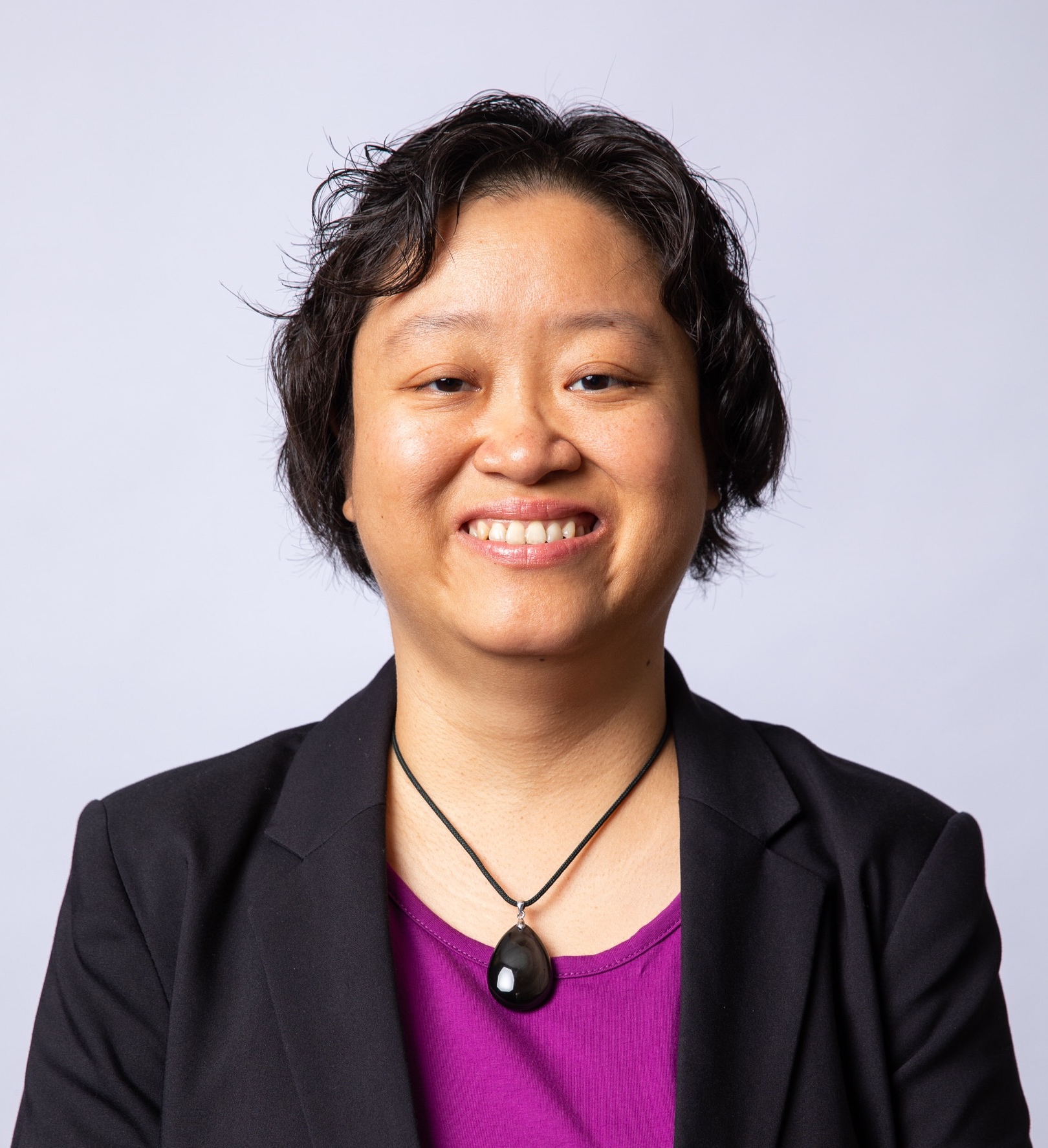 Dr. Kristy Shih in front of lilac backdrop