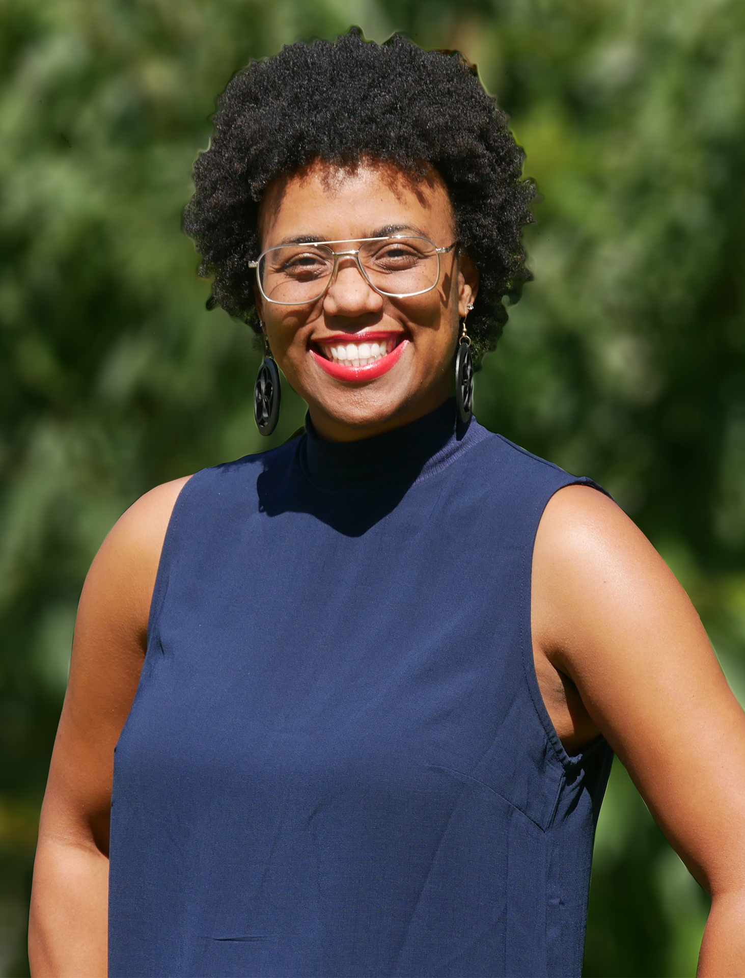 Leona Smith Di Faustino in front of greenery