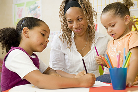 Children learning with a teacher