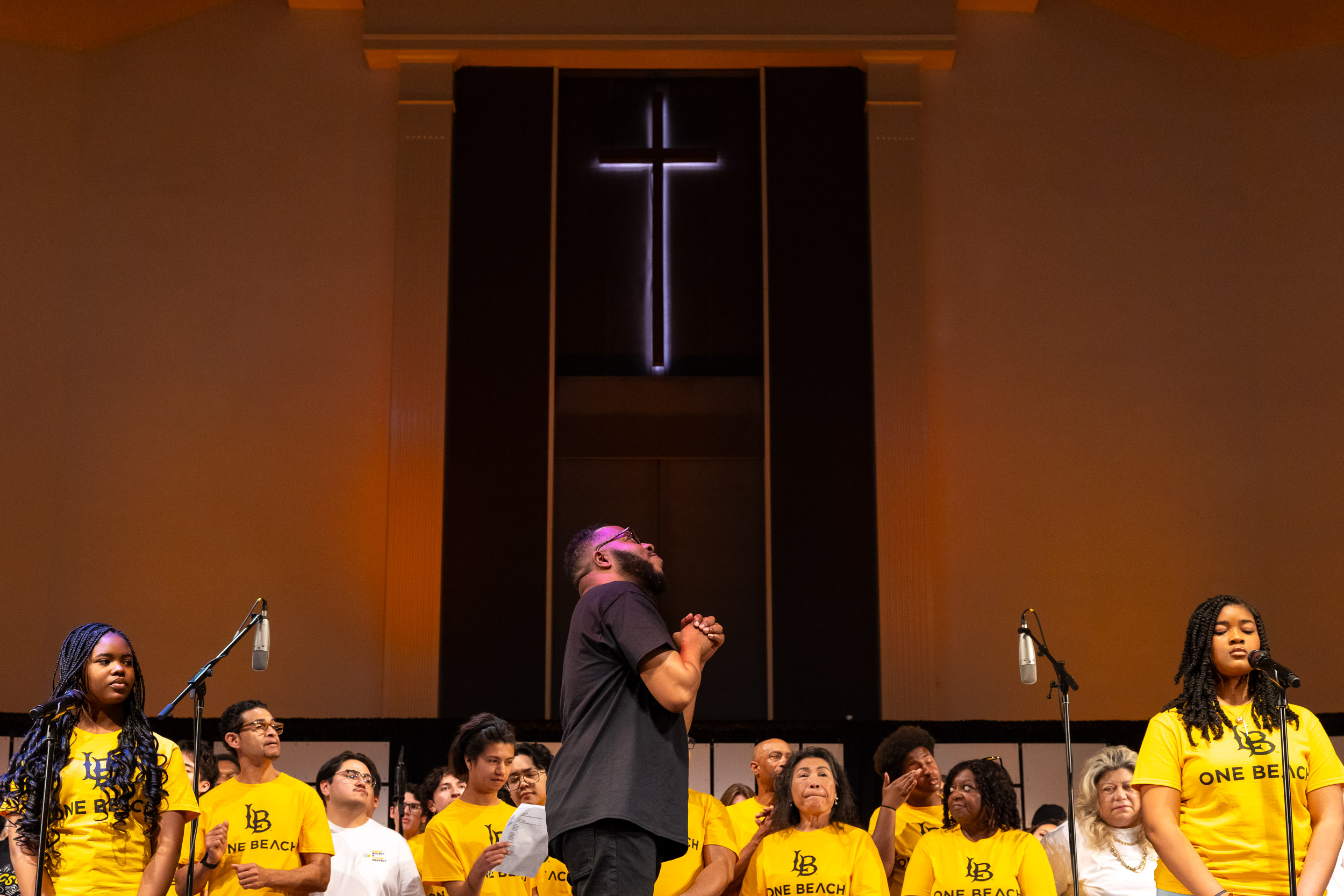 Ananias Montague listens as a student sings during Community Gospel Choir Concert