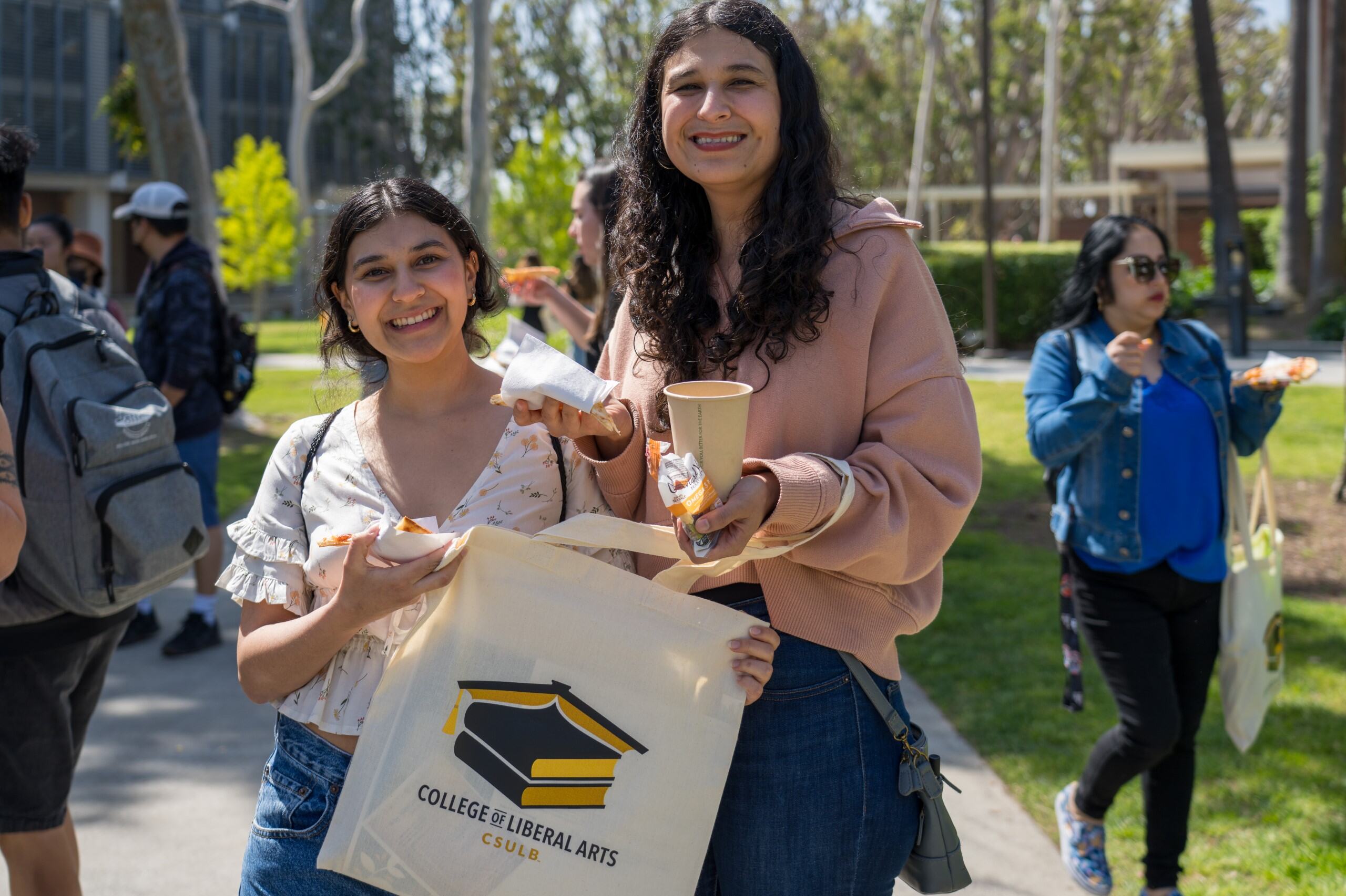 Students Displaying Swag Bag at Day at the Beach