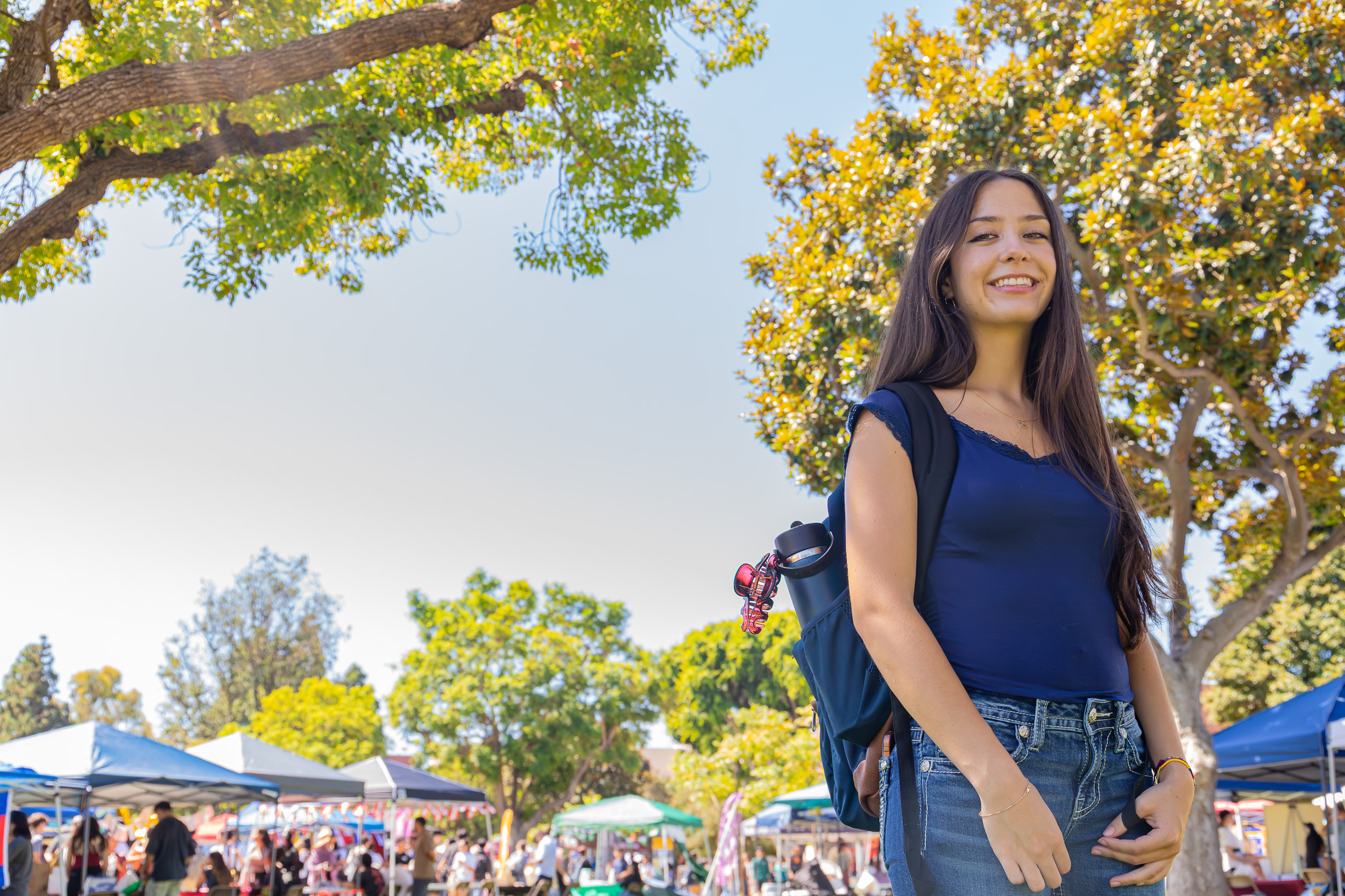 CSULB Student Camila Catron-Castillo amidst Week of Welcome booths CSULB Student Camila Catron-Castillo amidst Week of Welcome booths