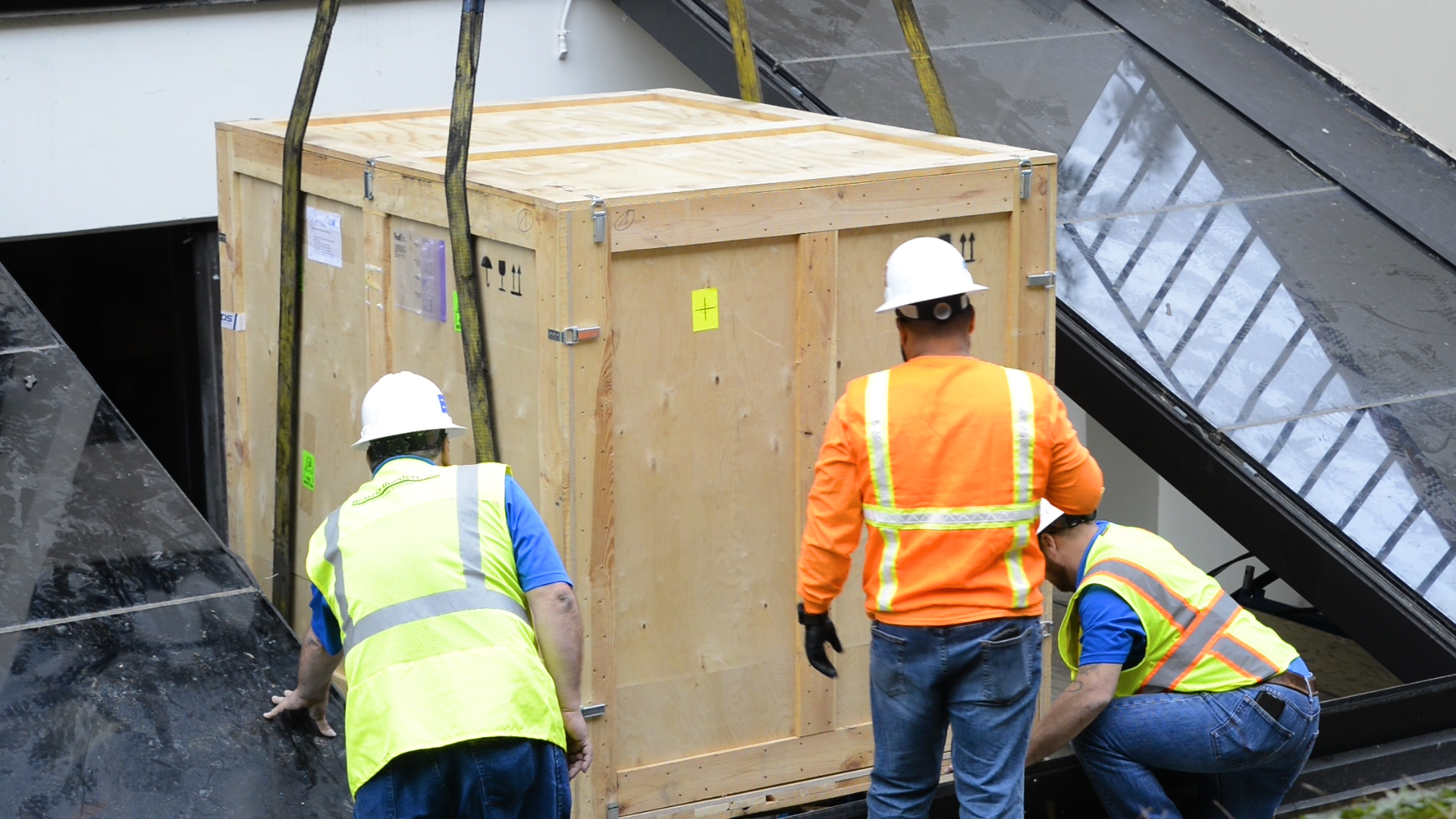 New 3D printers are lowered by crane into the University Library.