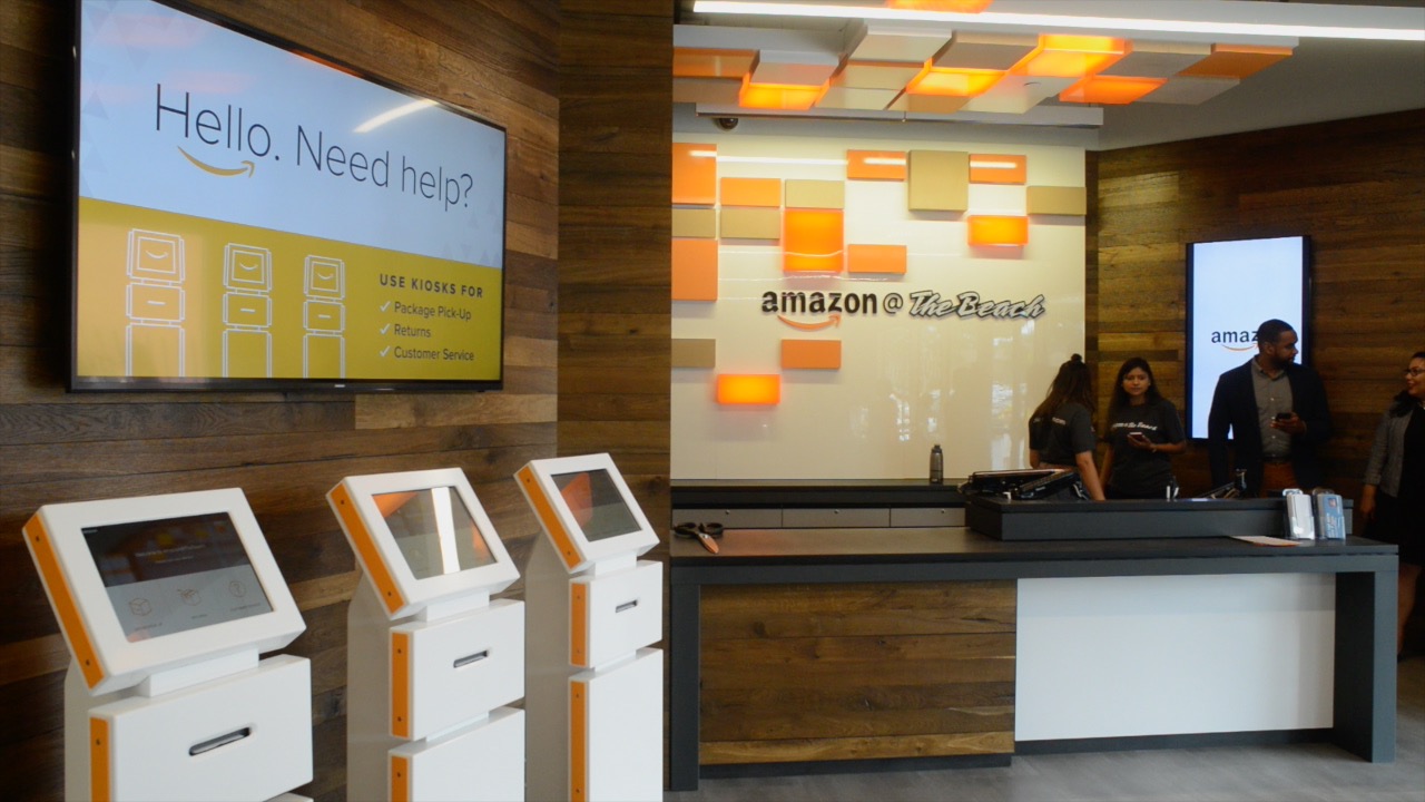 Students pick up books at Amazon at the Beach