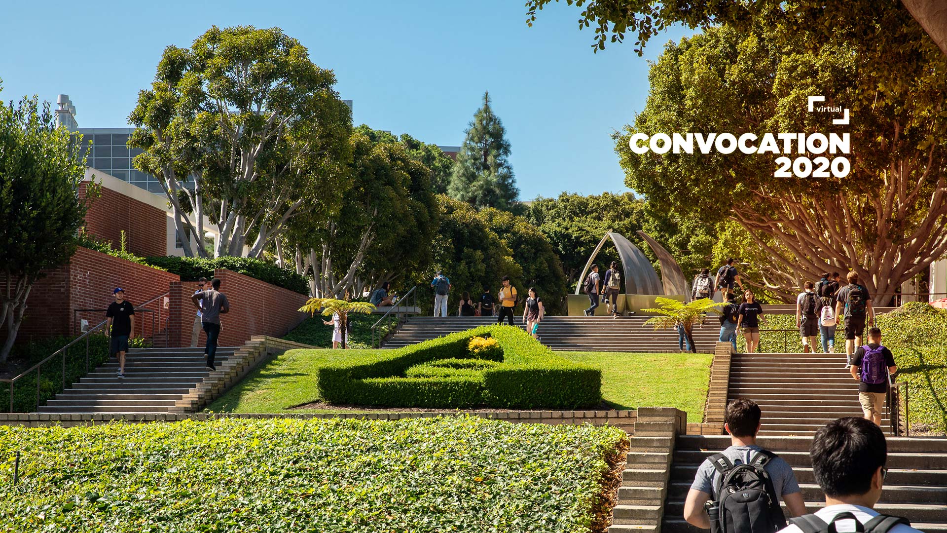 campus shot with students walking up stairs