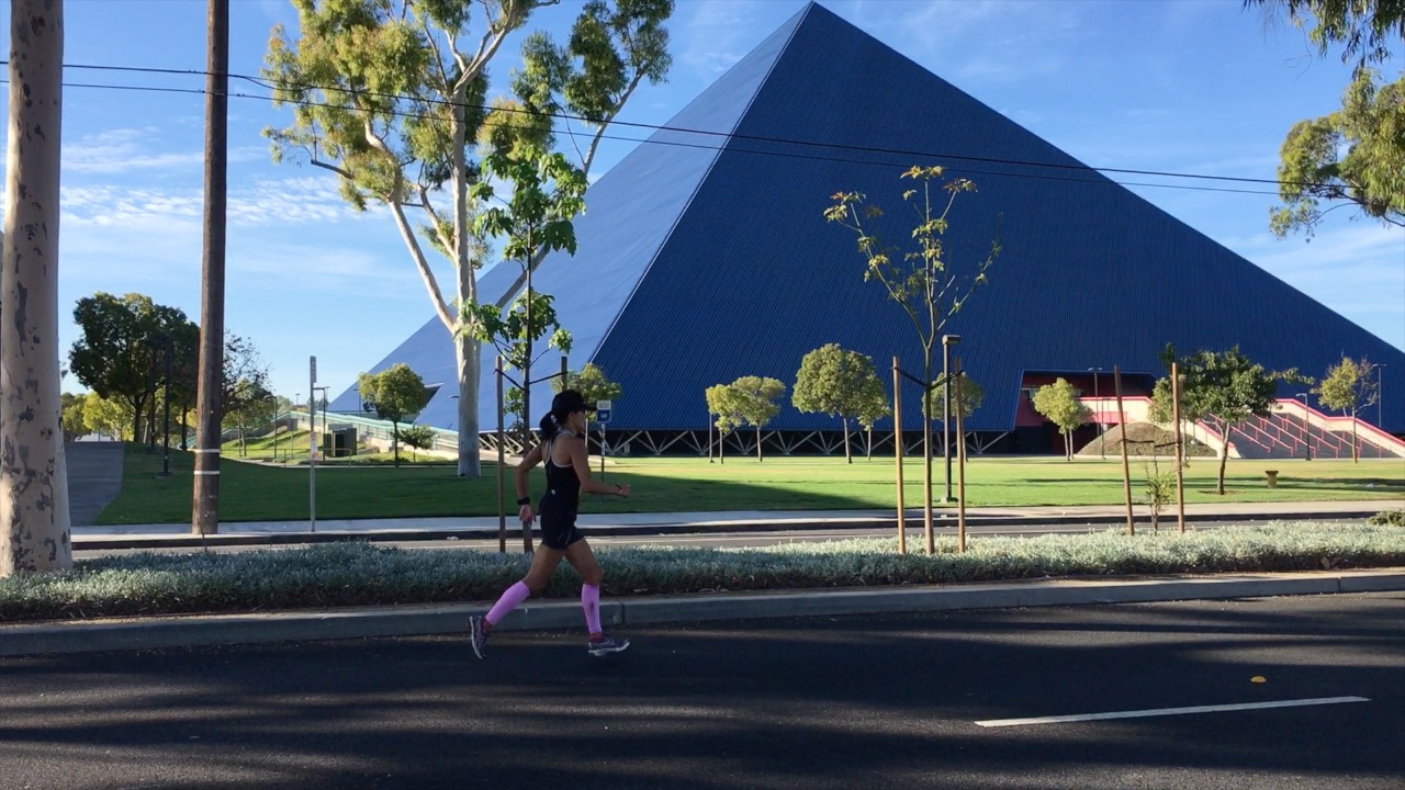 Marathon participants run across campus.