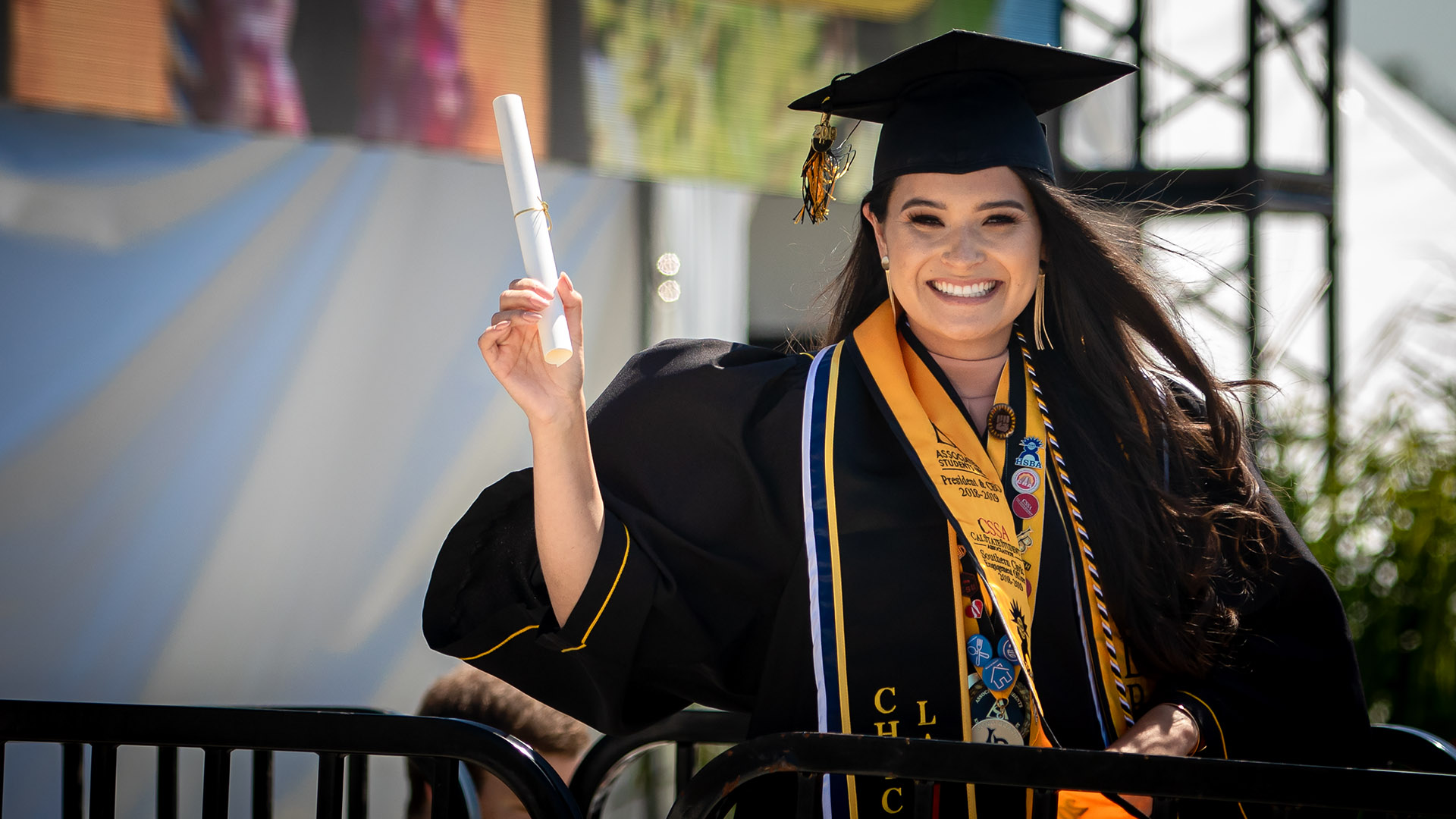 student holds diploma