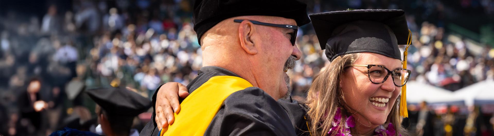 Bruce Mac Rae and graduate at Commencement
