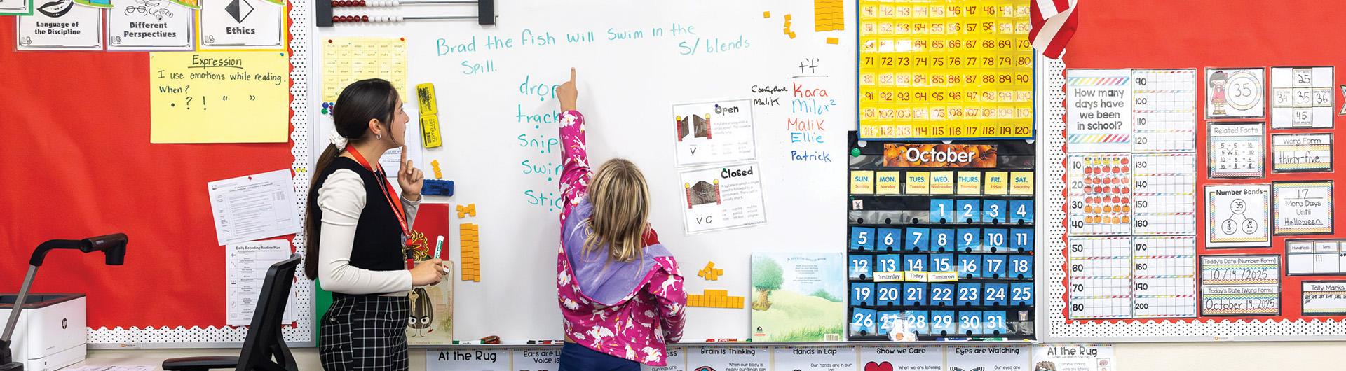 Marlee Aguirre helps teach a student at Mark Twain Elementary