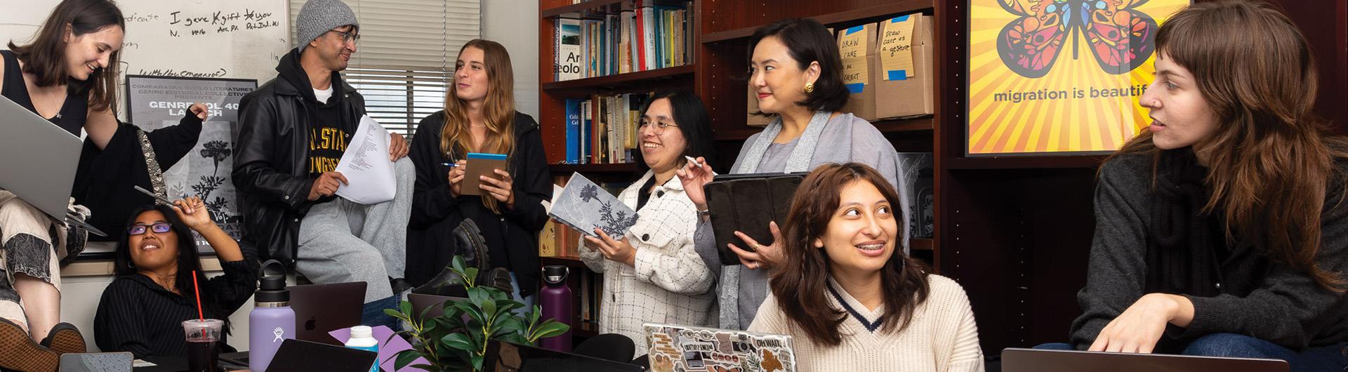 CSULB students and a professor inside Genre's conference room