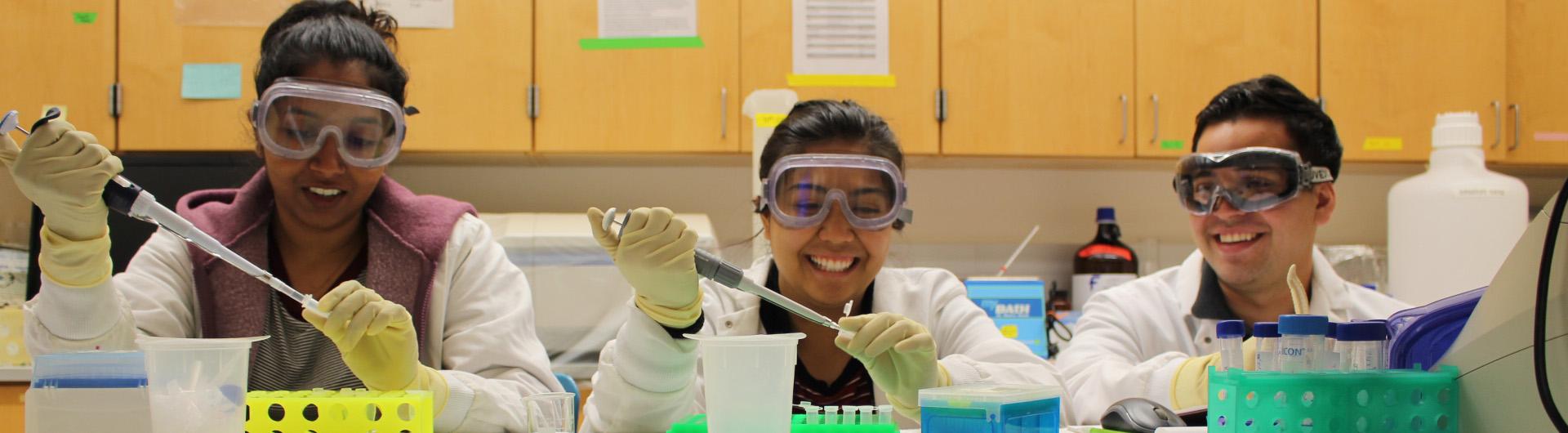 students pipetting in a lab