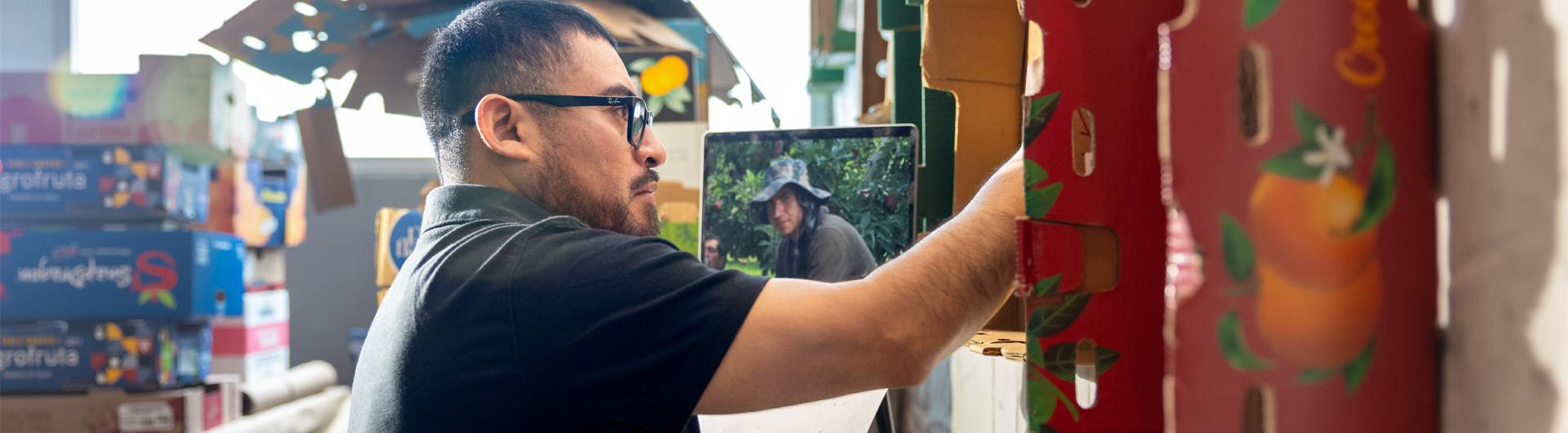 Narsiso Martinez paints in his studio