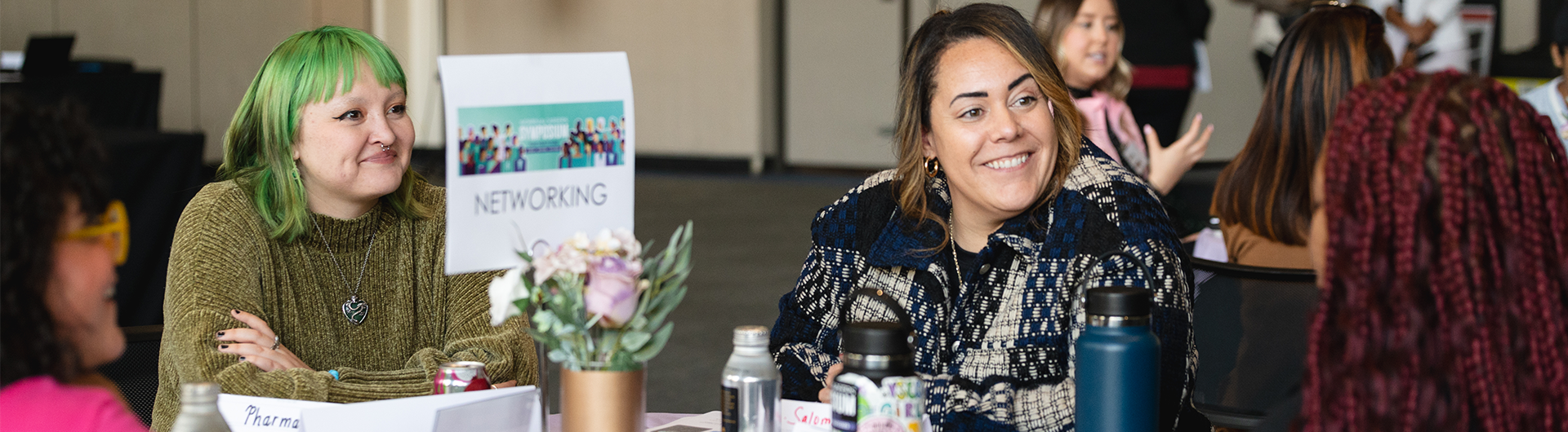Students networking at an event, discussing major and career exploration