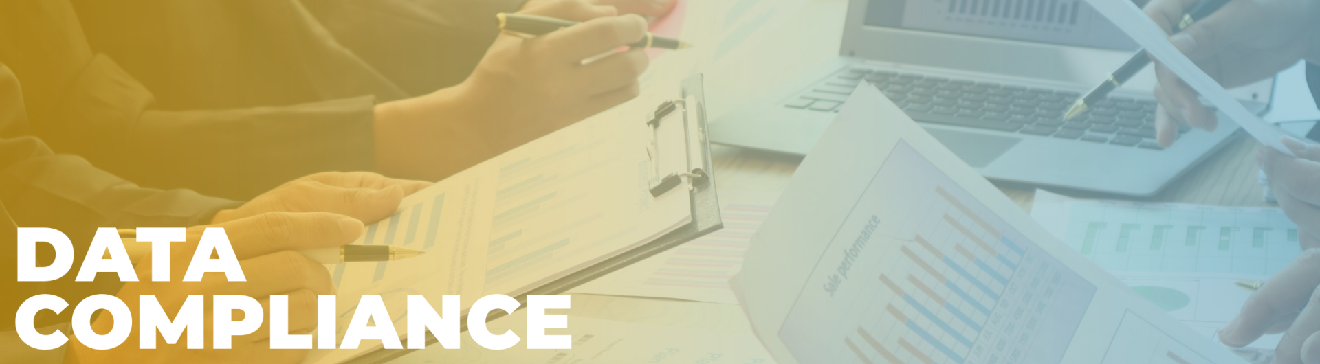 Data Compliance Banner Banner showing the text 'Data Compliance' in bold white letters. In the background, several hands are holding papers with charts and graphs, while one person is writing on a clipboard. A laptop displaying more graphs is partially visible in the background. The image has a soft yellow overlay, creating a professional and analytical tone.