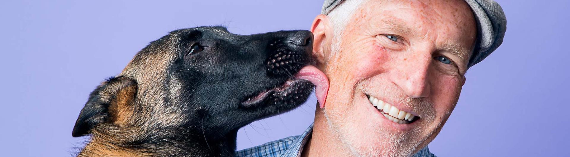 Dog licks owner's face