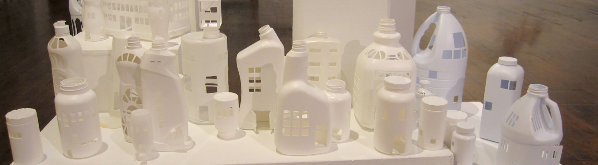 Gallery exhibit of art made from plastic containers