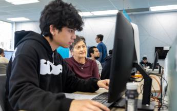 Student in COB LAB helping with a Ladytax preparation