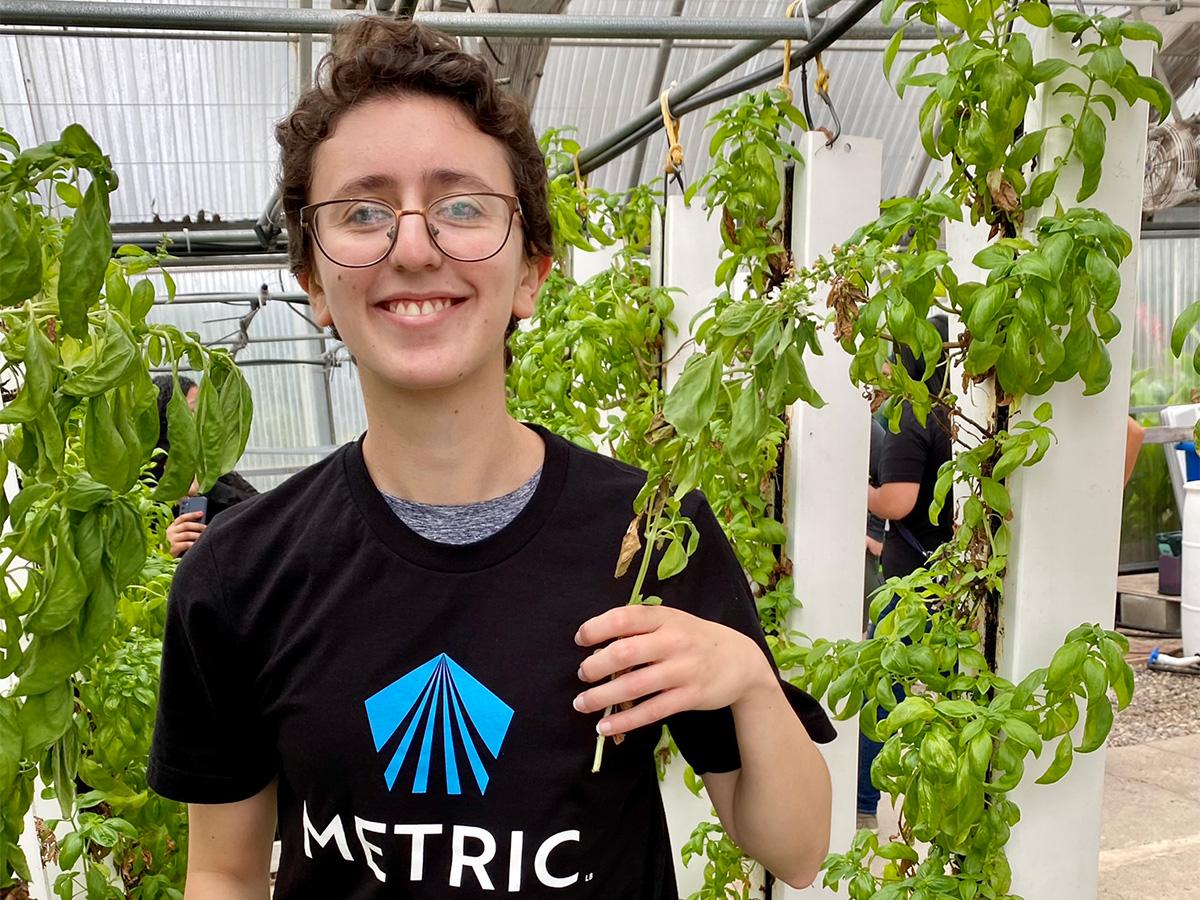 student holding basil