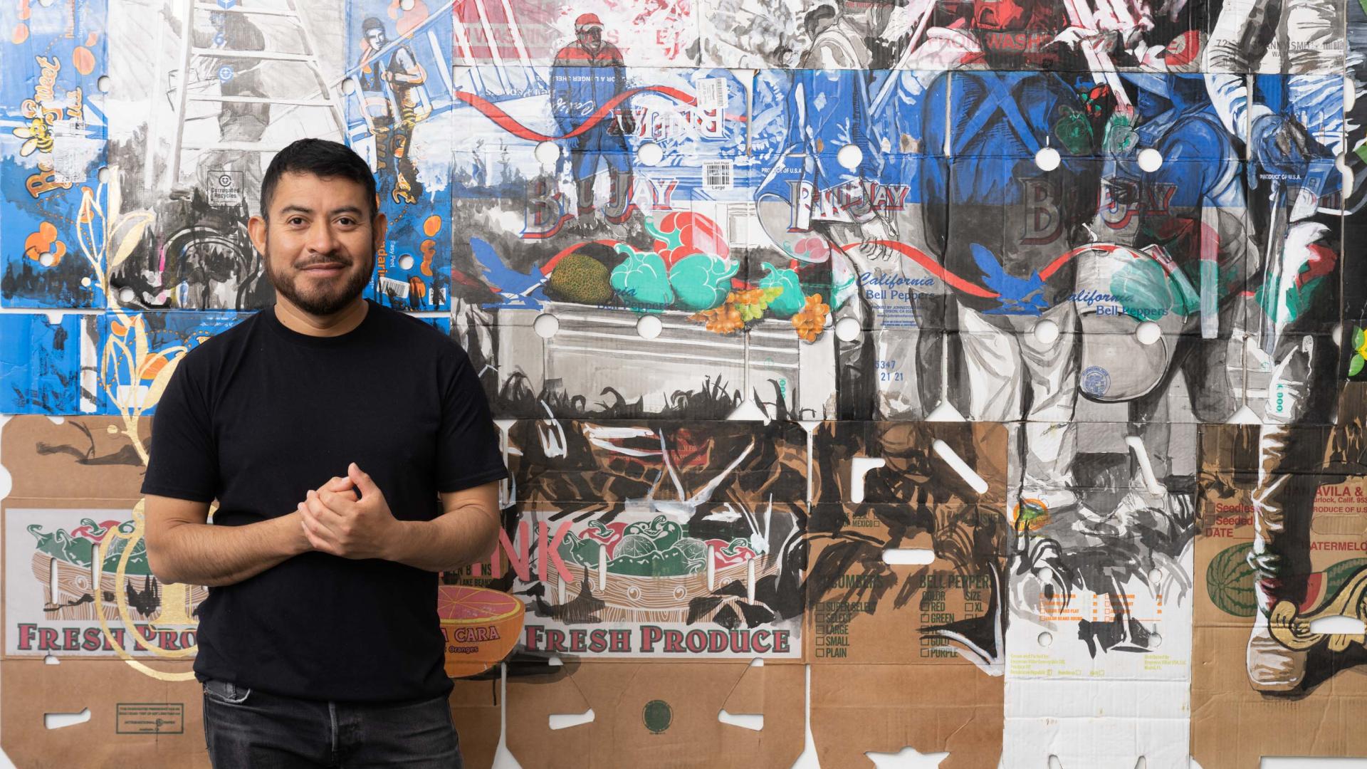 Narsiso Martinez stands in front of completed painting