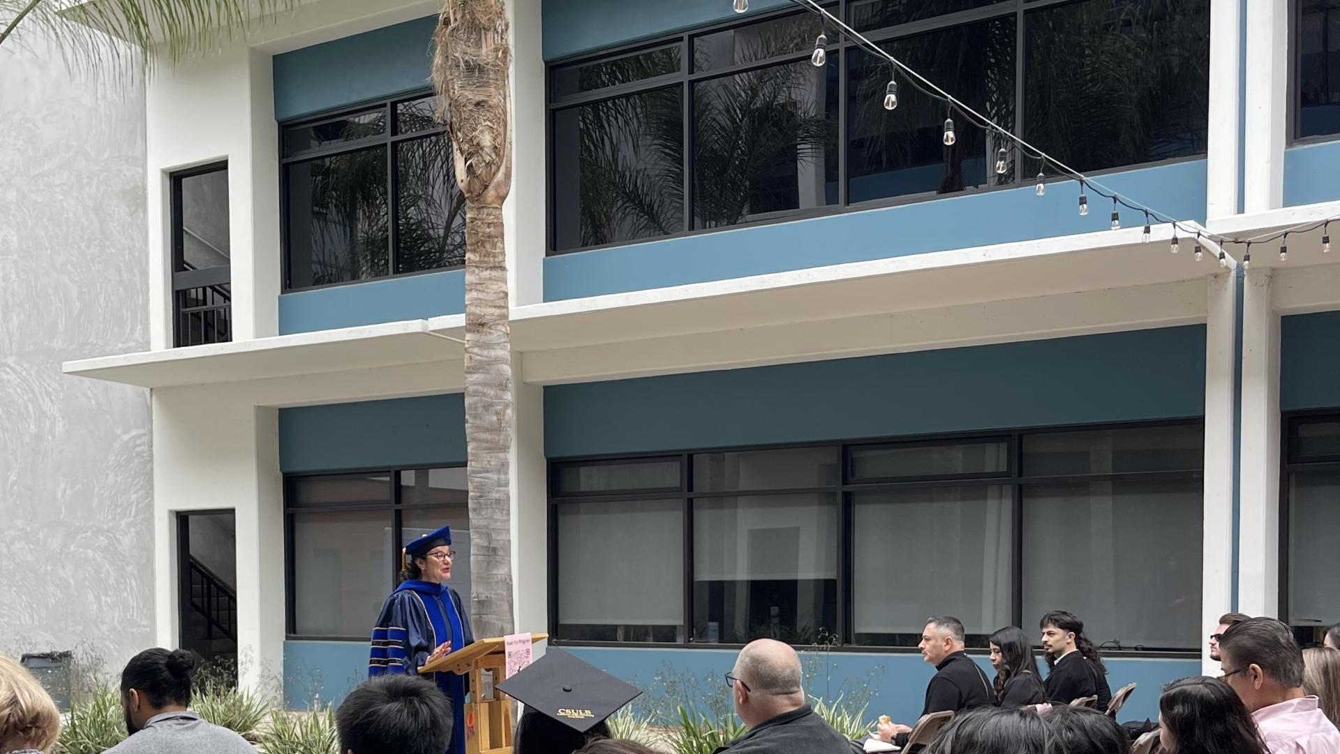 Dr. Mariya Mileva addressing the family and friends of graduating students.