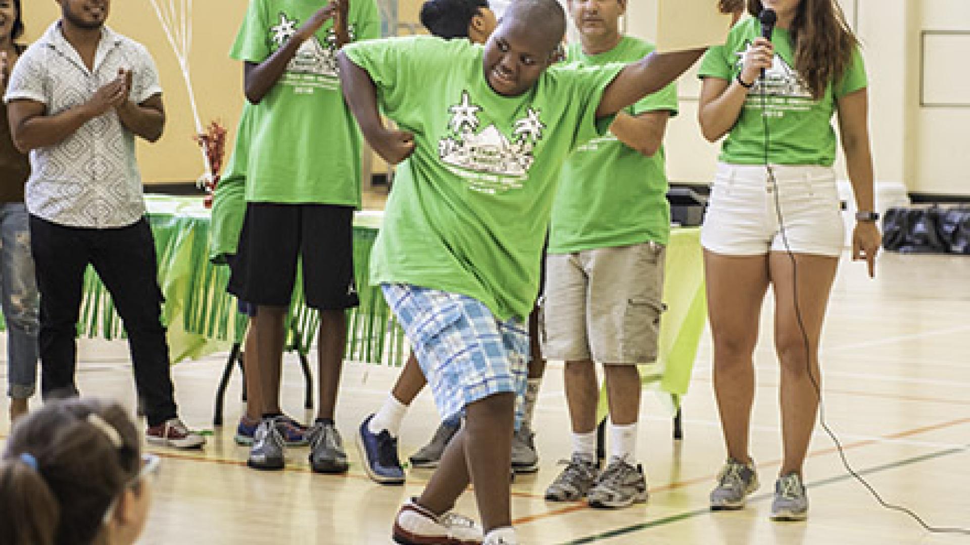 Boy does a dance move at Camp Nugget Boy does a dance move at Camp Nugget