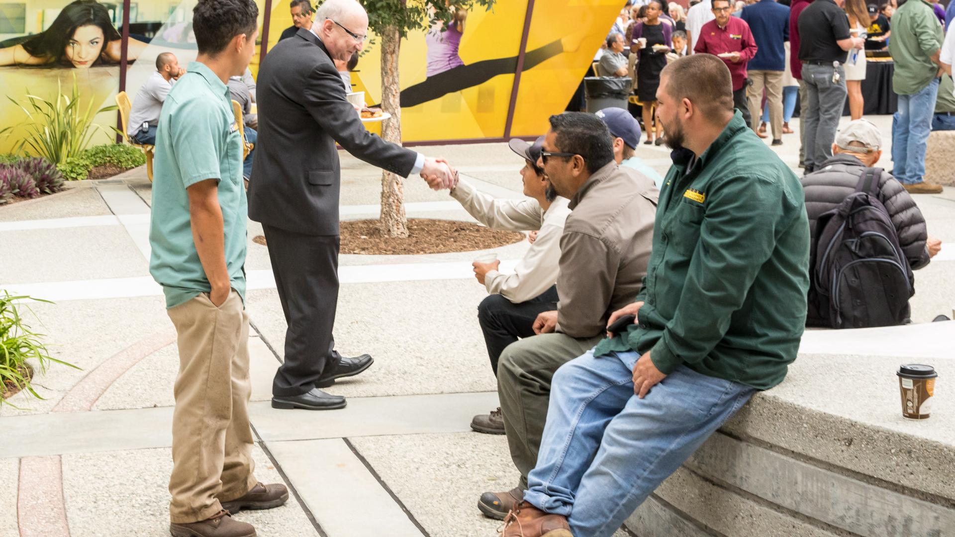 Brian Jersky mingles with guests before Convocation